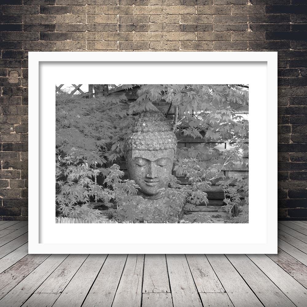 Glezna baltā rāmī - Head Of Buddha Among The Leaves Home Trends DECO