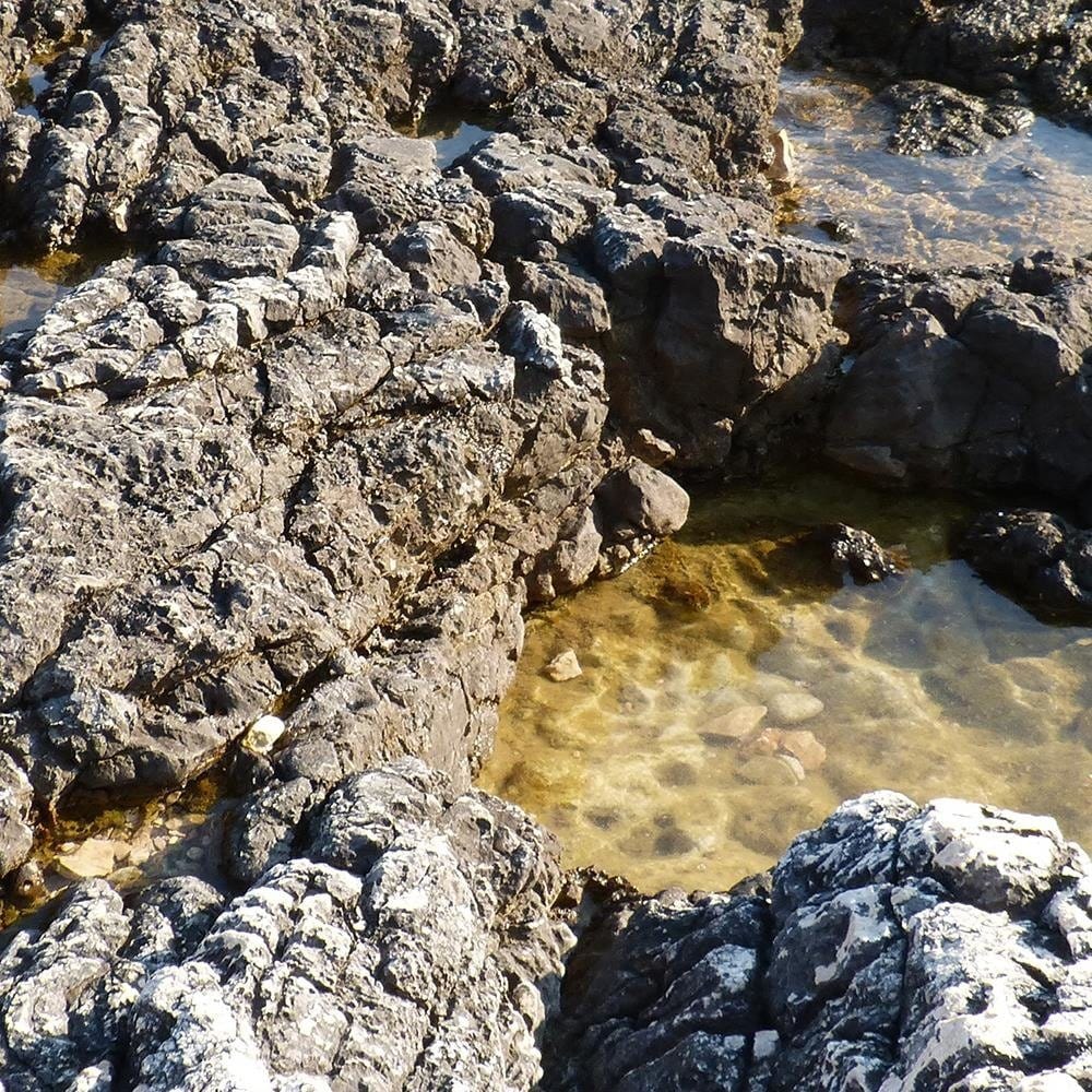 Glezna baltā rāmī - Rocks On The Shore Of The Ocean Home Trends DECO