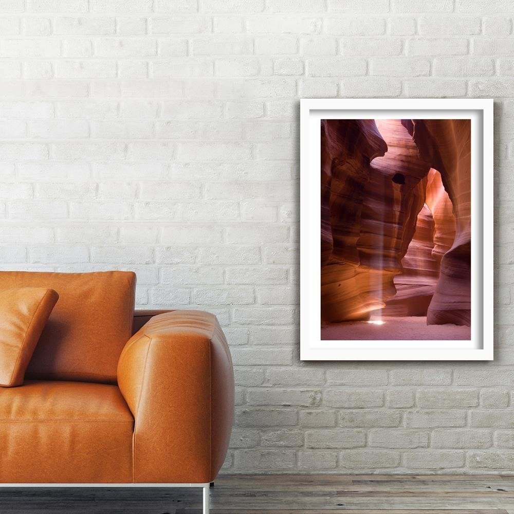 Glezna baltā rāmī - The Rays Of The Sun In The Cave Home Trends DECO