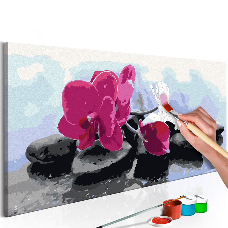 Glezna izkrāso pēc cipariem - Orchid With Zen Stones 80x40 cm Artgeist