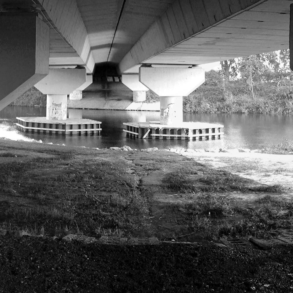 Glezna baltā rāmī - At The Concrete Bridge 