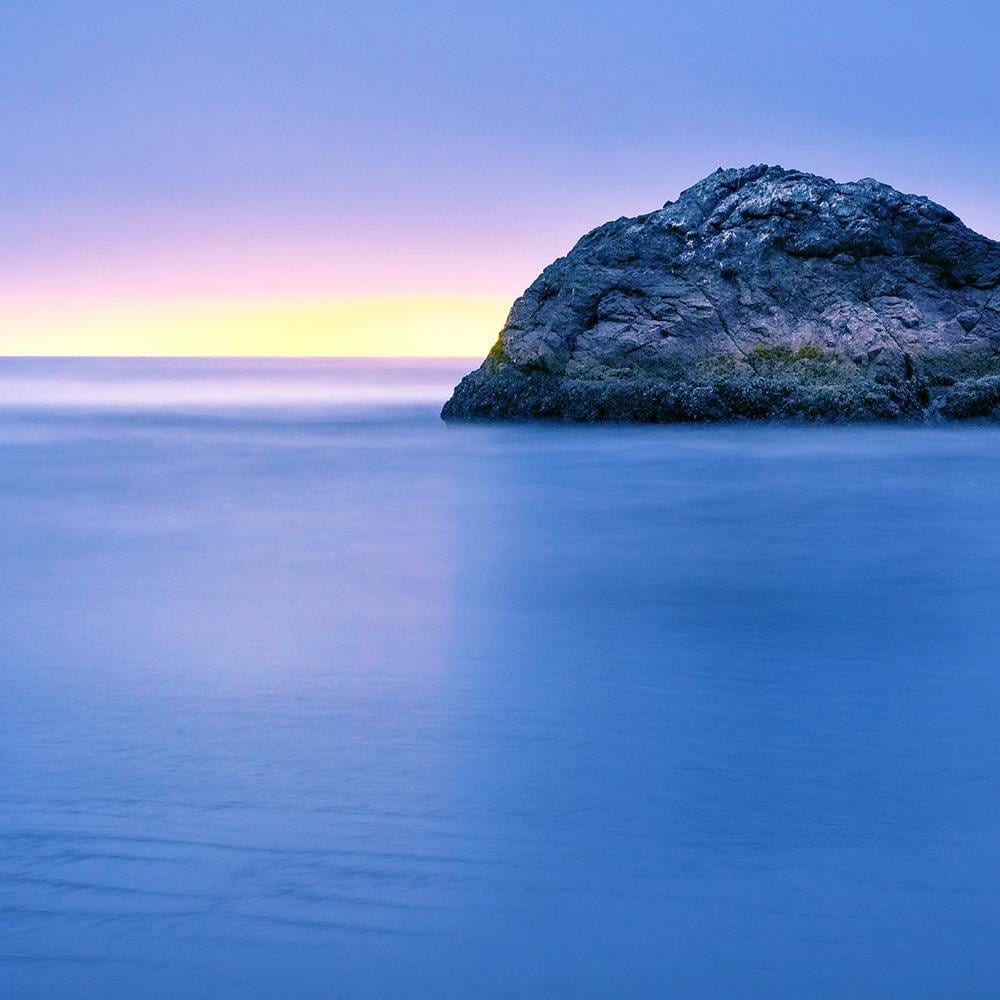 Glezna baltā rāmī - A Rock In The Sea At Dusk 4  Home Trends DECO